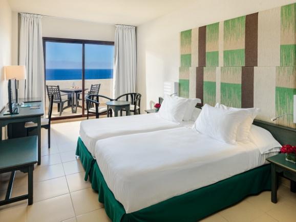 They can accommodate up to 2 adults and 2 children. The hotel has connected rooms, which are perfect for families. The hotel also has Sea View Double Rooms ($) with a balcony overlooking the sea.