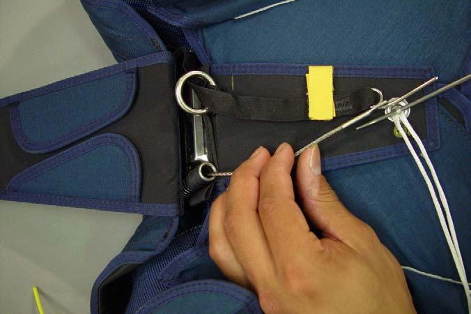 INSTALLING A RESERVE LANYARD (RESERVE STATIC LINE OR RSL) 1. Inspect the RSL: Check the stainless steel snap shackle is operating smoothly and that the spring will retain the locking pin.