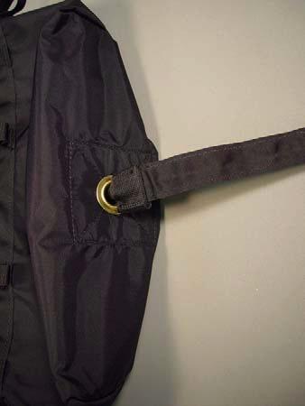 Pull the two fabric loops on the bridle back so they rest against the grommet on the inside of