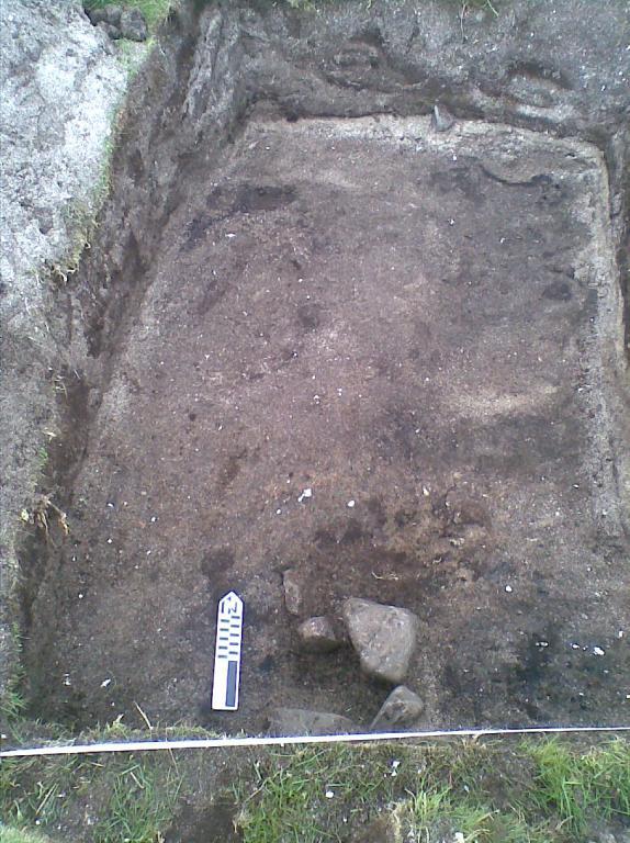 Pic 3. Trench 2. Floor deposit and a posthole. unit [2] three deposits were recorded.