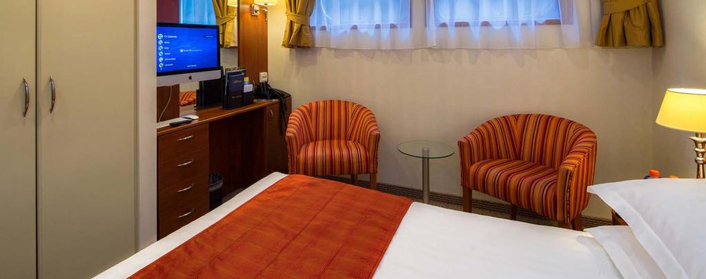 Stateroom: Category E Size: 170 sq. ft. with Fixed Windows Delight in the amenities of this well-appointed room that offers a scenic view from fixed windows just above a sitting area.