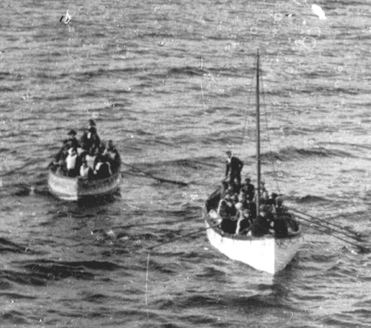 silence. Survivors in the lifeboats huddle together, some rowing to keep warm. 3:00 a.m. Officers and crew begin to gather the boats together and redistribute the survivors.