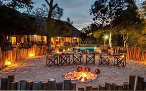 The exquisitely appointed main lodge overlooks a waterhole frequented by a large herd of elephant and other big game. The explorer suites are all linked to the main lodge by raised wooden walkways.