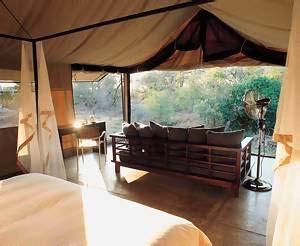 A private outdoor seating area in front of each tent allows guests to relax and take in sights and sounds of the bush.