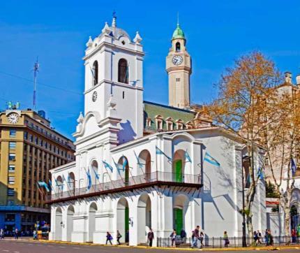 Arrive at the main square, Plaza de Mayo, which is surrounded by the Government House and the first City Hall.