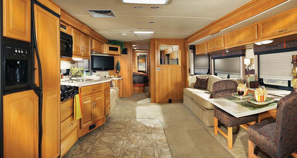 EXPEDITION 38F shown in Ebony interior décor with Symphony Cherry wood cabinetry.