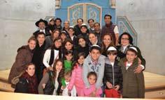 Joseph and Ivette Woldenberg (right) and Dina and Solomon Waisburd (bottom row, third and fourth from left) with their families, and Director of the Latin-America,