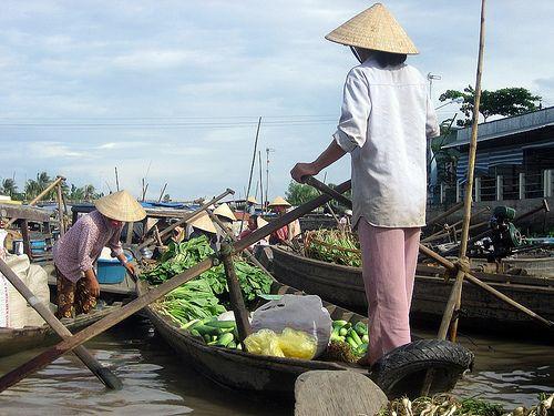 This morning, after breakfast, transfer to the pier then embark on an elegant traditional Mekong wooden ship, and cruising during sunrise, visit Cai Rang floating market where thousand commercial