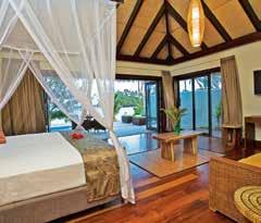 An eco-friendly boutique beachfront resort set against a beautiful mountain backdrop which melts into a crystal clear lagoon, showcasing premium luxury accommodation and set in authentic tropical
