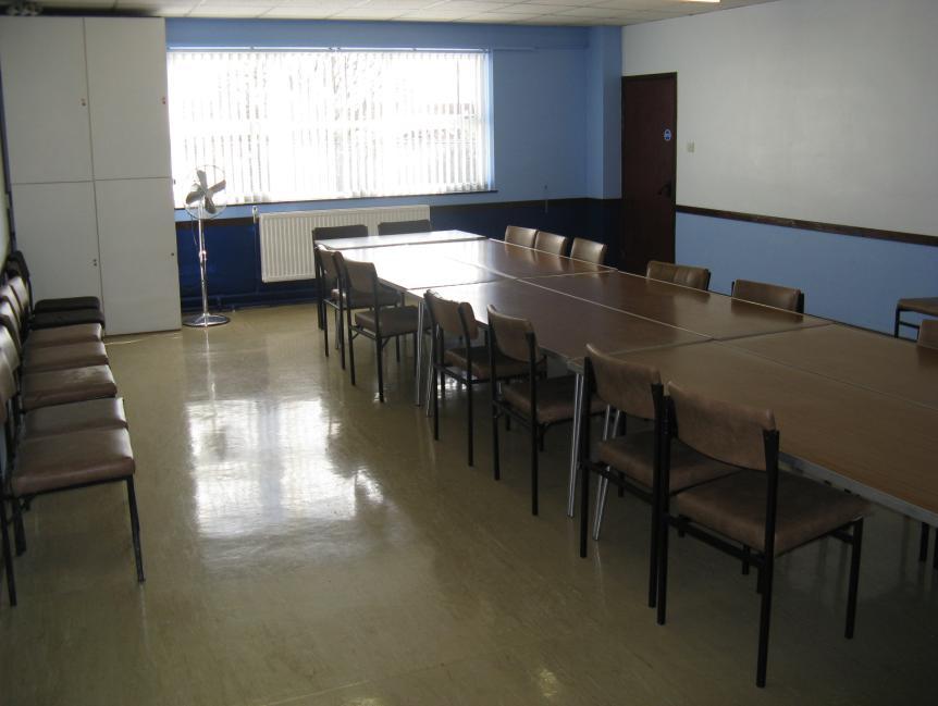 seating throughout. It is air-conditioned and has a large screen TV which can be connected to a PC for presentations.