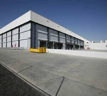 The facility has a high bay steel portal framed warehouse with significant curtilage areas and features eight on-grade roller shutter doors and five recessed loading docks.
