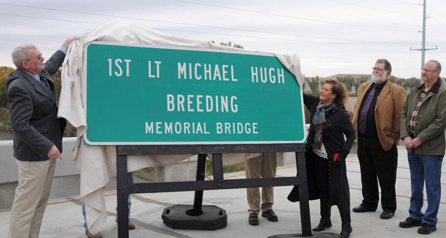 Signs designating the bridge as the 1st Lt. Michael Hugh Breeding Memorial Bridge were also unveiled.