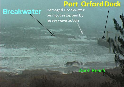 Figure 11. Dock at Port Orford, Oregon, 19 November 2012, 10:00 a.m. during winter storm wave activity. Offshore waves were from the south 20-to-25 ft high. View is to the southwest.