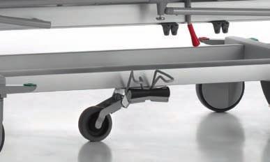 The red pedal activates the brake, whereas the green pedal deactivates it.