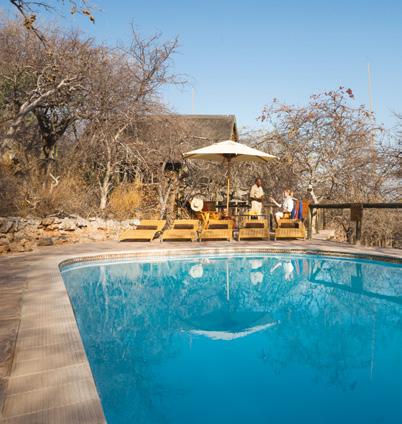 Perched on a ridge with seemingly endless views across the plains, Ongava Lodge s air-conditioned brick, rock and thatch chalets, each with
