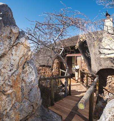 A long boardwalk meanders over rocks and trees, connecting the beautiful main lounge and dining area with one of three breathtaking, secluded thatchroofed