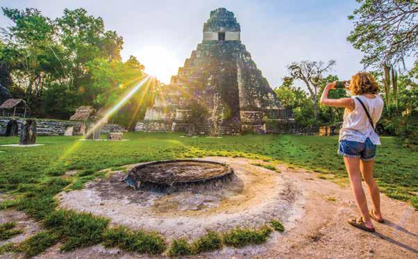 BELIZE TO TIKAL: REEFS, RIVERS & RUINS OF THE MAYA WORLD 9 DAYS/8 NIGHTS NATIONAL GEOGRAPHIC QUEST Temple 1 looms large over the main plaza at Tikal.