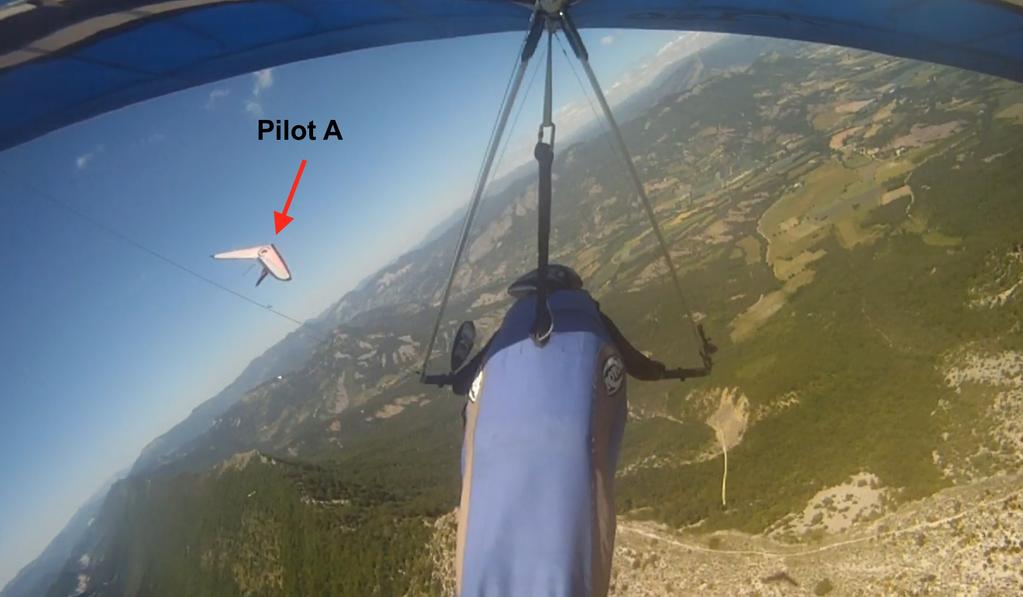 Photo C. Still from Glider B approximately 23 seconds prior to the collision. Pilot A can be seen on the left, with the position of Glider A s wing obscuring Pilot A s view of Glider B. 2.4.