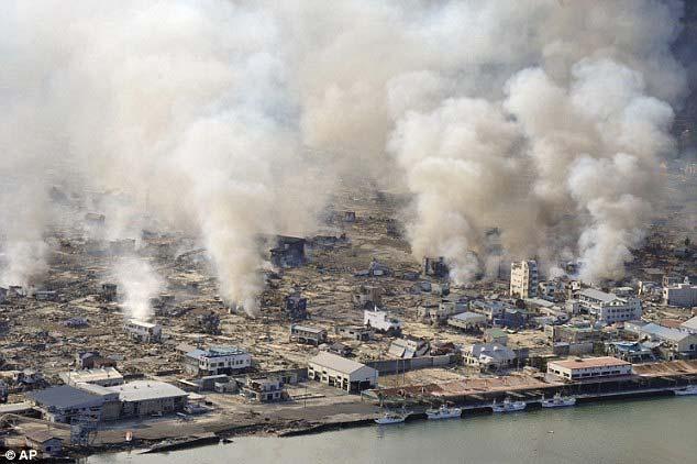 tsunami hit yesterday Disaster: White smoke rises from houses still