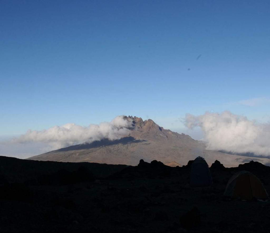 MOUNT KILIMANJARO Mount Kilimanjaro, the highest mountain in all Africa at 5,895 meters, dominates the north-eastern marches of Tanzania.