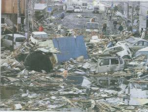 The piles of wrecked cars and debris in a