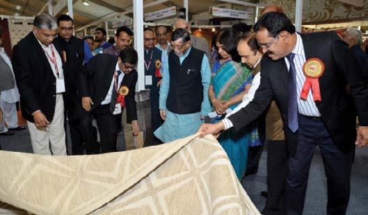 Report-ICE 2016 {The Hon ble Union Minister of State for Textiles (I/c), Secretary (Textiles), DC (H), Direcotr (Handicrafts) appreciating the quality of the products displayed at an exhibitor stall