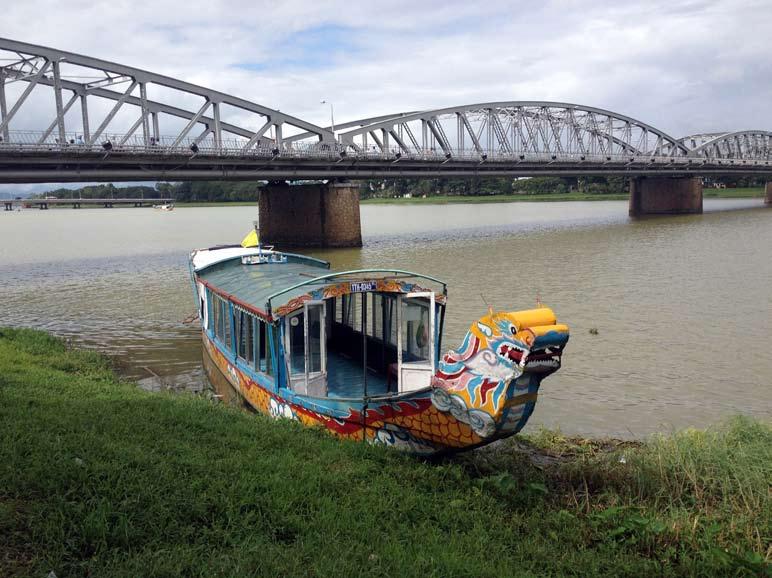 I walked along the Perfume River, admiring the colorful dragon boats, and then crossed a