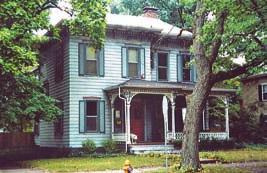 There is a small side porch which is similarly detailed and a balcony on the front façade. Michael Stack, an early owner, was a traveling agent.