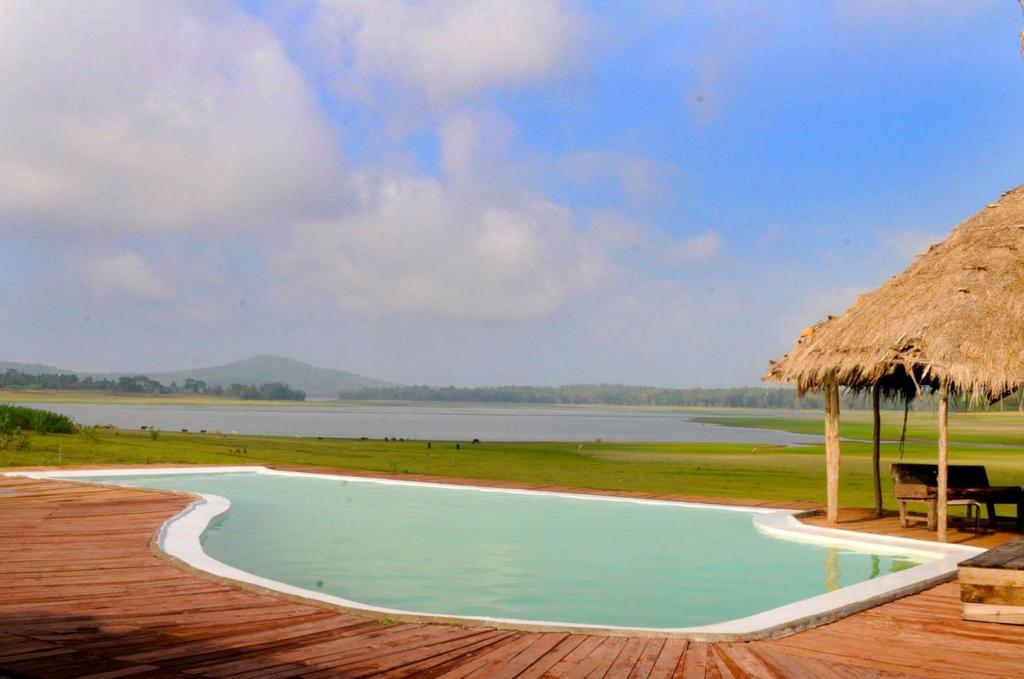 THE BISON RESORT The Bison Camp boasts the most idyllic waterside location, on the edge of Nagarhole National Park.