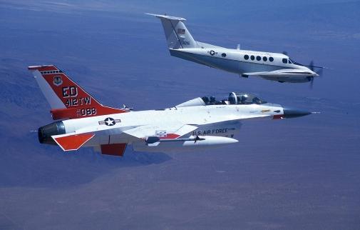 Staff photos by Guy Aceto Above are a twin-engine C-12 and an F-16B two of the many aircraft used by the students