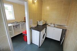 There is also a dish-washing facility plus a laundry area with sink, washing