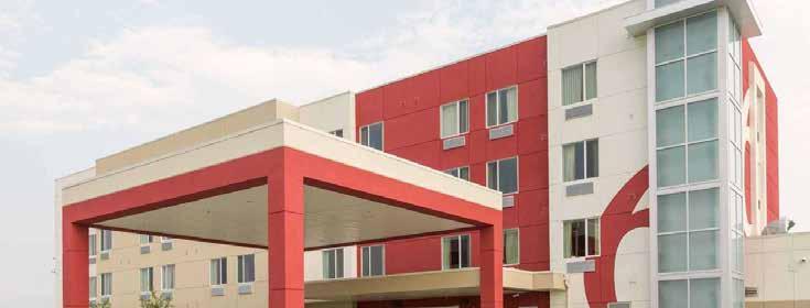 MOTEL 6 - Airdrie Completed May 2014 DETAILS: Ground up construction of a 36000sq ft, 80 room 4 storey hotel with pool and