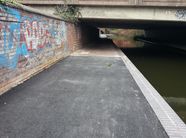 Paving underneath Islington Row Bridge has been re-set to allow for required drainage profile.