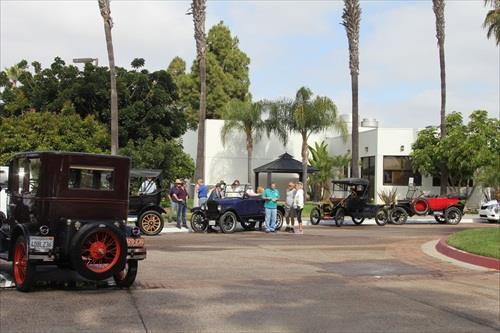 Several Model T on the sands at Mission Bay Park Members cars outside the Four Seasons Hotel