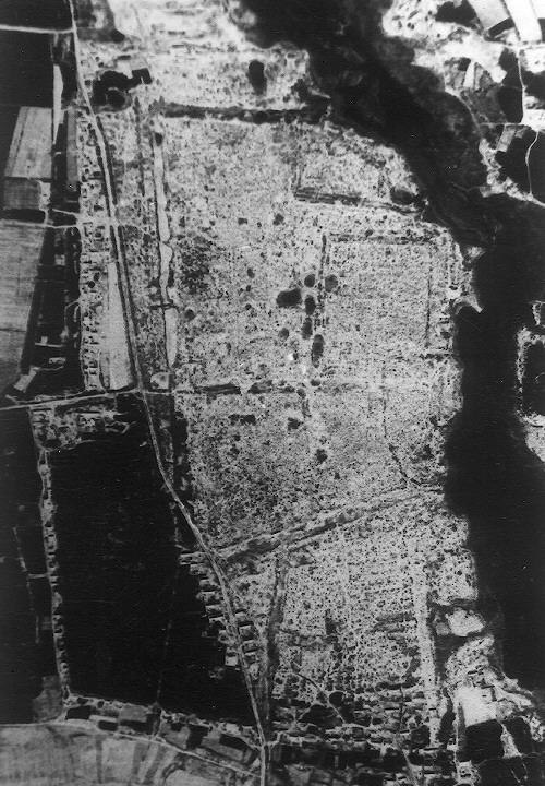 The 1959 black-and-white aerial photo shows only a few modern settlements within the ancient city. The exterior city wall, interior city wall, moats, and buttresses are clearly shown.