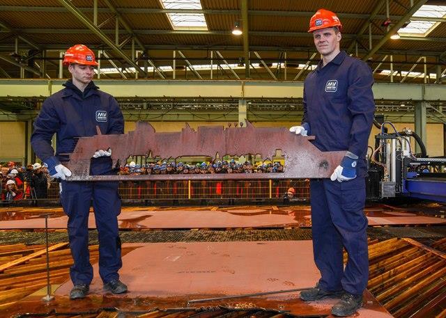 MV Werften staff display the handiwork of the steel cutting equipment # # # About Genting Hong Kong Genting Hong Kong is a leading corporation principally engaged in the business of cruise and cruise