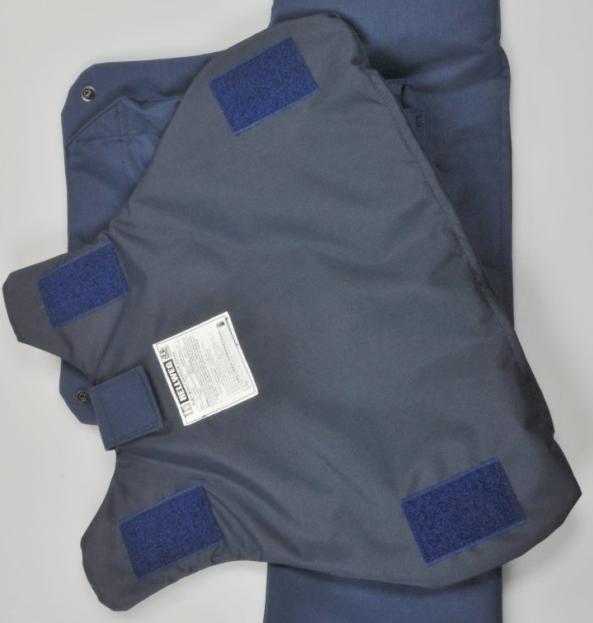 The anti-ballistic panels are securely attached and correctly positioned within the garment with a combination of hook and loop