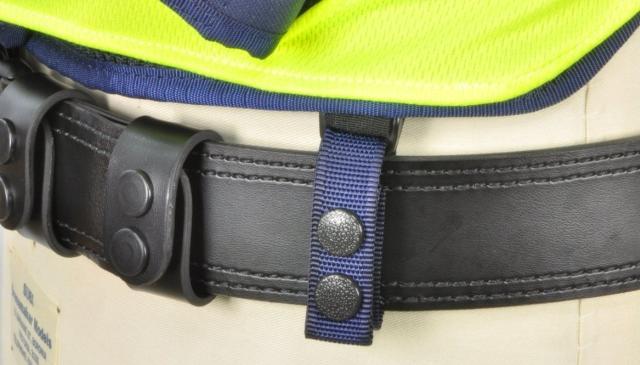 The front mounted elastic belt loops stabilise and prevent excessive movement of the load bearing platform when engaged in duty activities whilst still allowing freedom of body movement and the rear