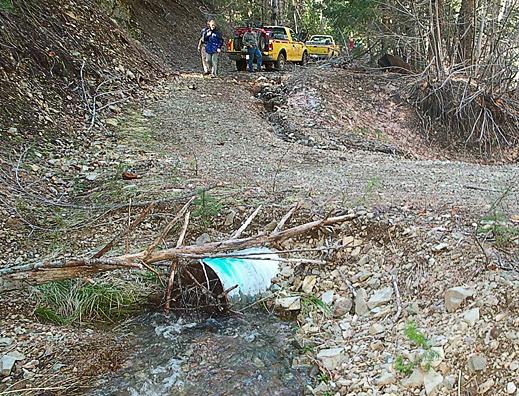 Stream undercutting at the base of the slope below the road caused this landslide. Photo: Richard Harris. Other Impacts Roads are the primary source of nonpoint source pollution in rural areas.