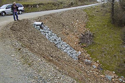 migrating fish). Any new culvert on a stream that supports fish must allow passage; many deficient culverts are being replaced. Photo: Richard Harris. Figure 16.