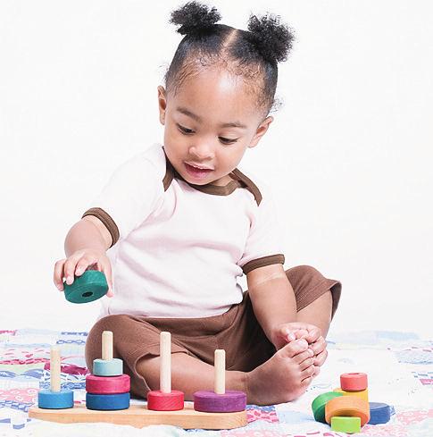 When teaching new skills, start with what your child knows and enjoys. Building a tower teaches balance. Play is the way children learn. They love to play with their parents and other caring adults.