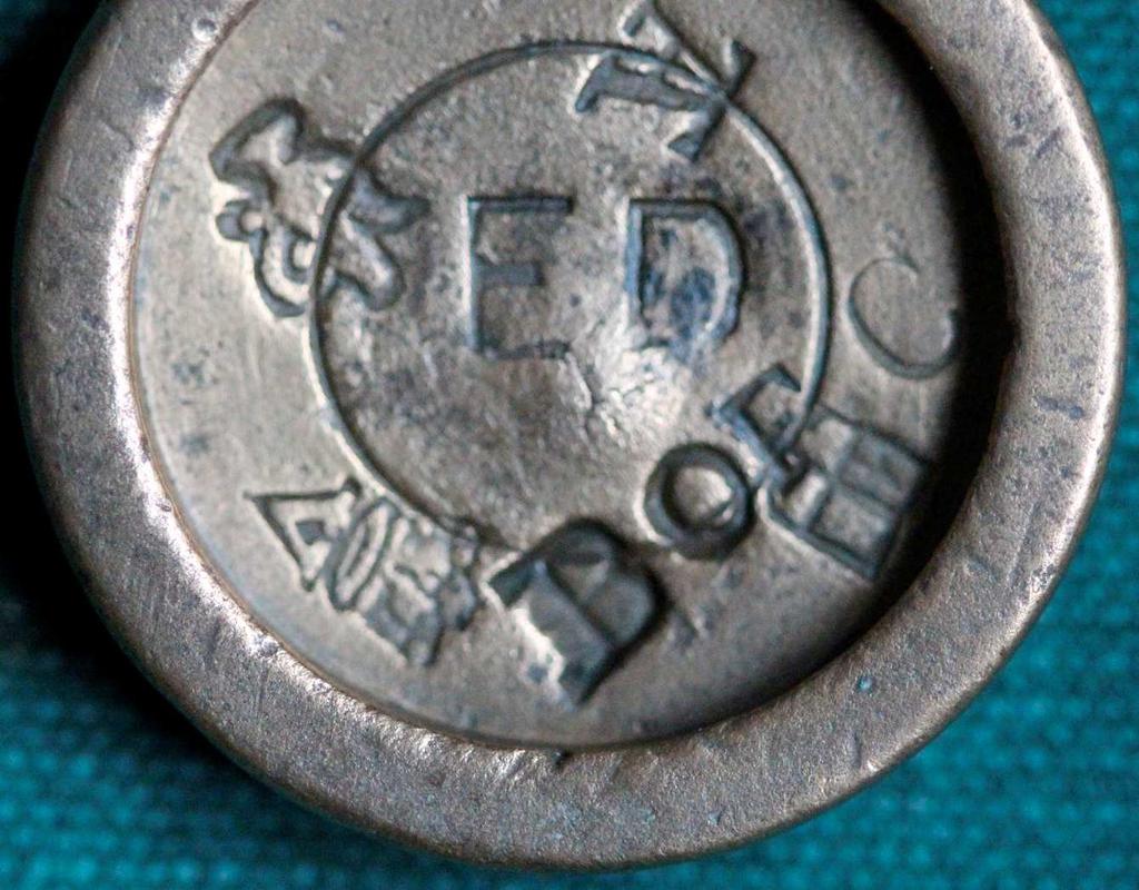 Stamped with the initials ED, this weight was stamped in 1855/6, when the Taxors were the Rev Joseph Edleston, of