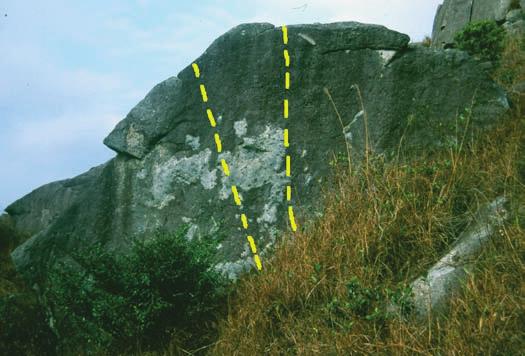 To the left of the crack is a thin wall with a hollow flake near its top. Climb the wall avoiding all holds in the crack. Thin and reachy. (3) V0-5a ** Hand Crack. The fist sized crack line.