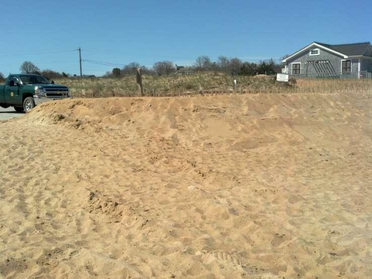 Sturdy fence buried under new dune