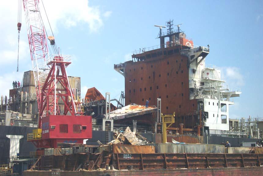 The M/V HANJIN PENNSYLVANIA (port) in Singapore during salvage and recovery operations.
