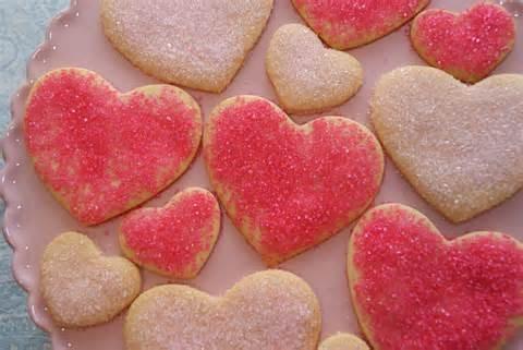 Chocolates Heart shaped brownies 3) Cook them in the oven for the minutes that the cookie dough package says. 4) Once they are done, get some white cake icing and mix pink food coloring in it.