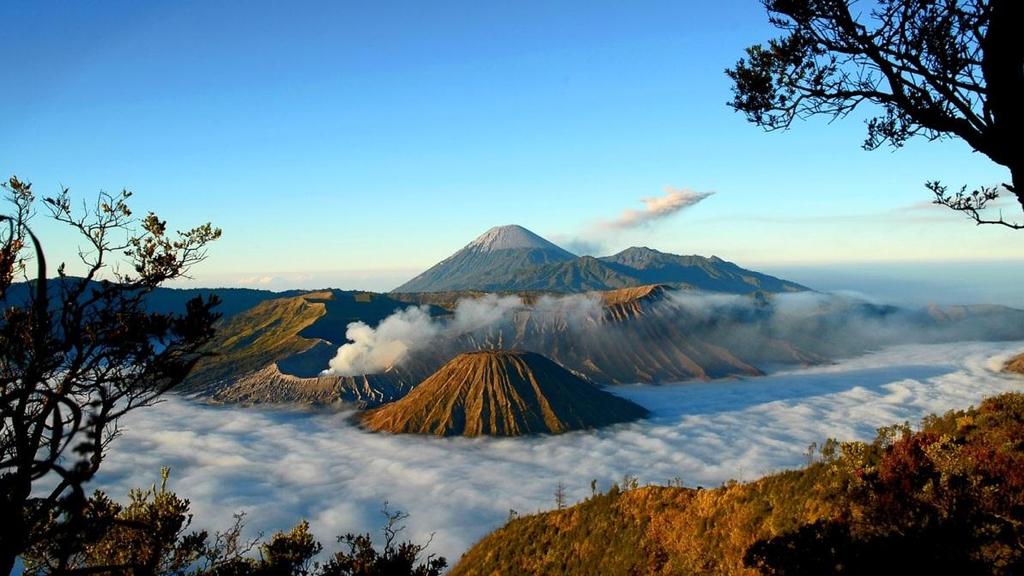 Bromo Mountain Tour One of active volvano inside Tengger massif in East Java. Places to visit : 1. Sunrise Spot at Pananjakan. 2.