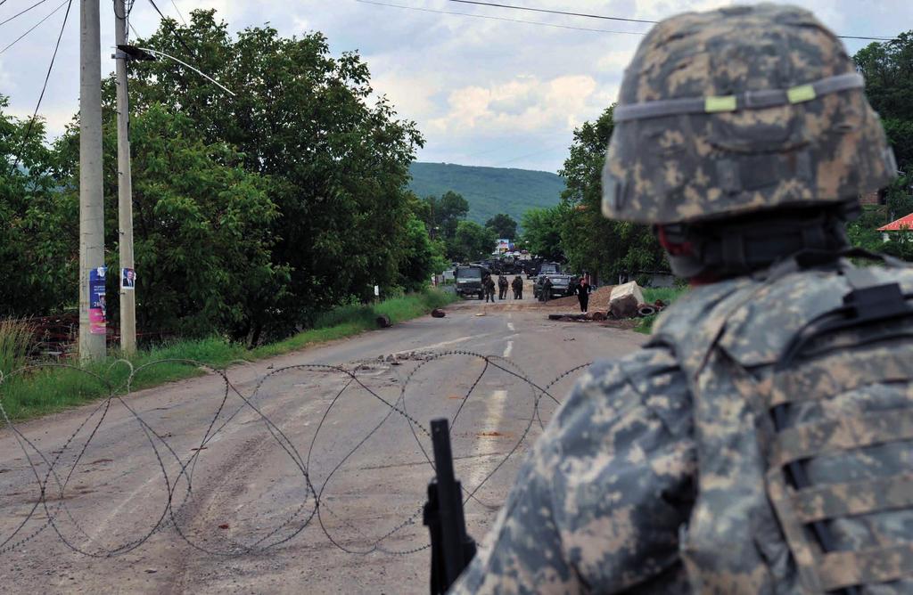 Photo US Army J. Wagner KFOR removed a roadblock on the outskirts of Rudare preventing freedom of movement to the people of Kosovo, June 1, 2012.