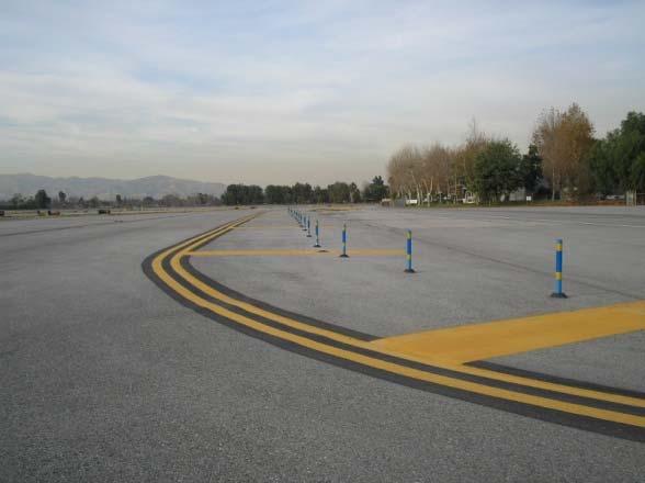 Green or unpainted areas beyond the solid double yellow edge lines may not be full-strength pavement and are not intended for aircraft use.