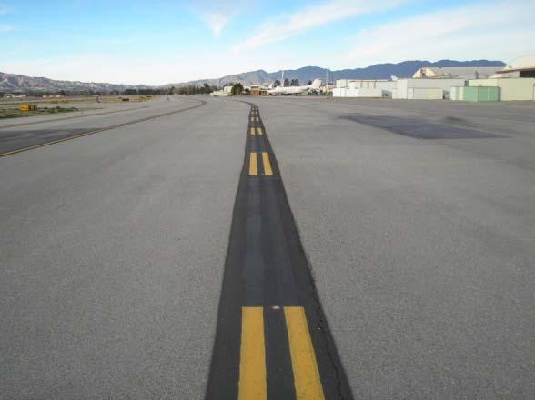 Taxiway Edge Line a solid double yellow line defines the edge of the full-strength pavement.